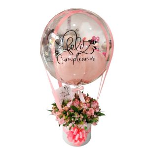 Cilindro de rosas rosadas con follaje y globo burbuja personalizado, entrega rápida en Cali