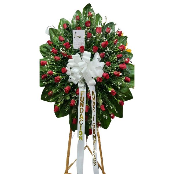 Corona fúnebre con rosas rojas y follaje blanco, entrega rápida en Cali